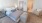 a bedroom with a bed and a chair