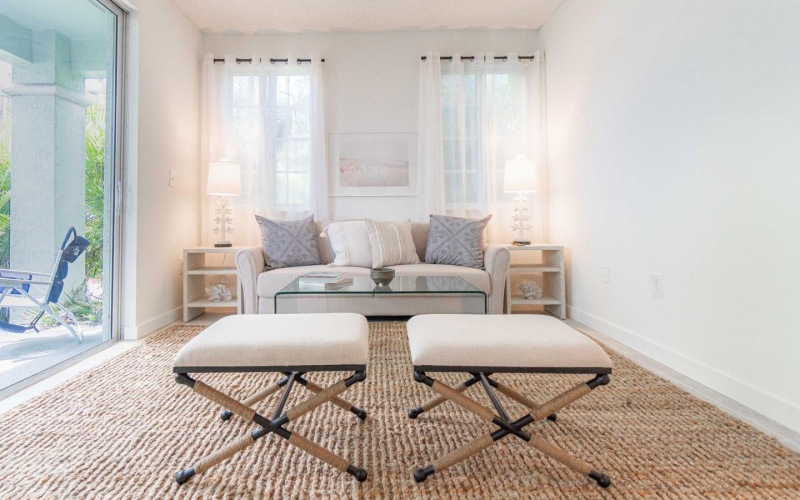 a living room with a glass door