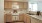 a kitchen with white cabinets