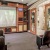 a room with chairs and a screen