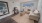 a living room with a large rug