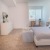 a bedroom with a bed and a table