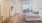 a bedroom with a bed and a table